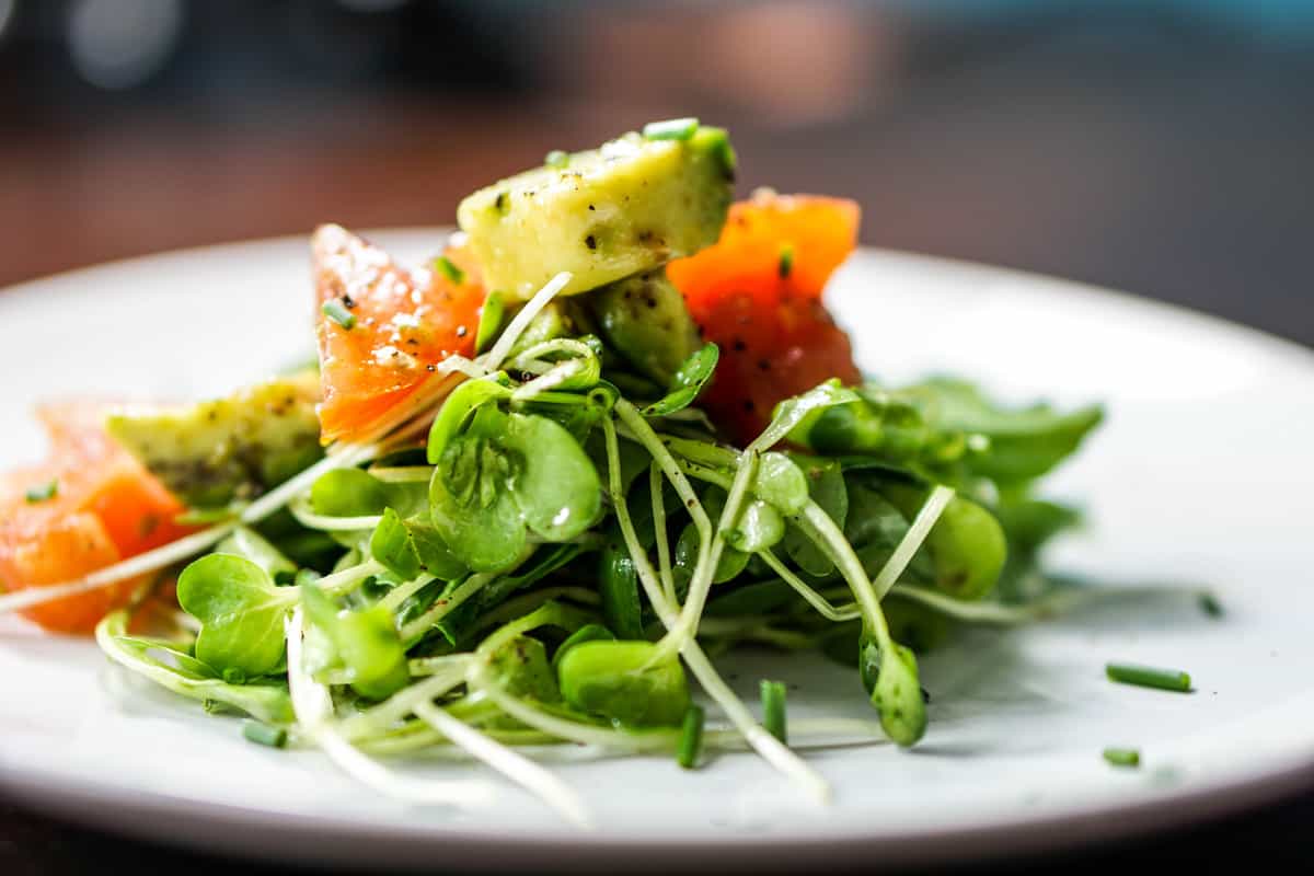 Quick, Easy and Nutritious Salad: Tomato and Avo on Arugula and Micro Greens