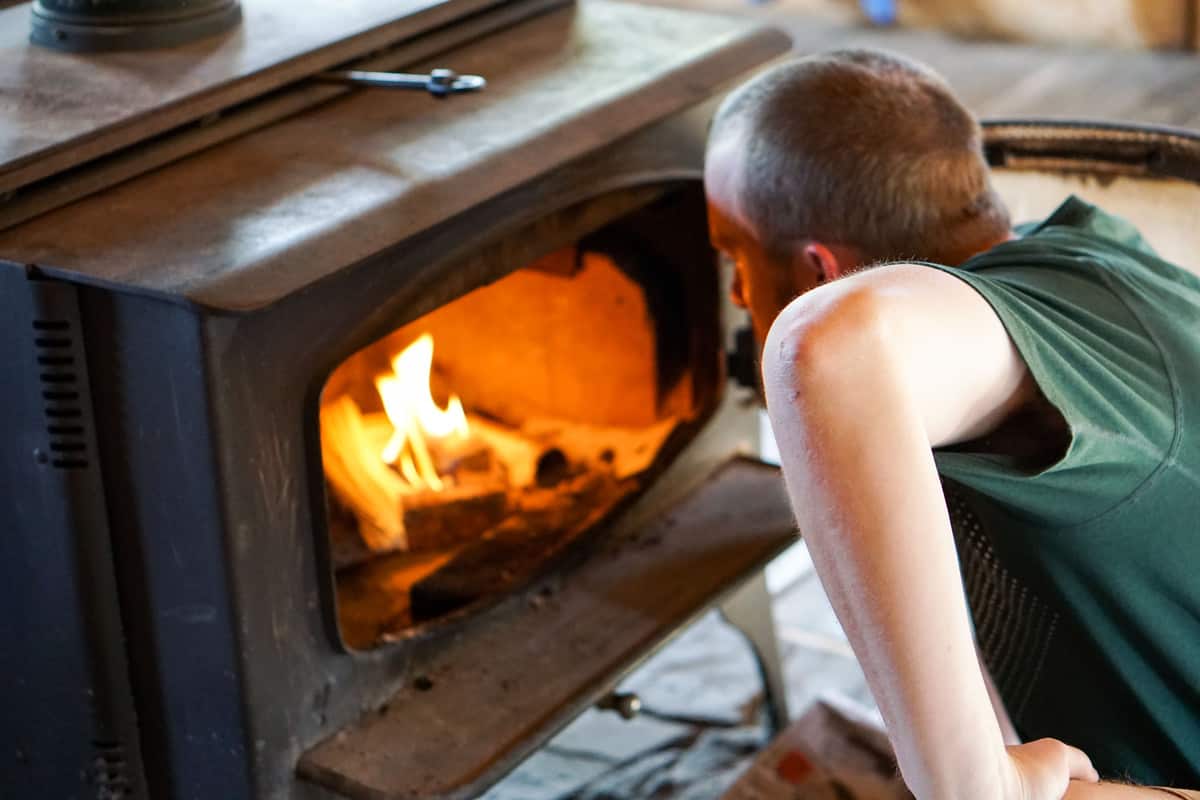 Lighting the fire in Francie's Cabin