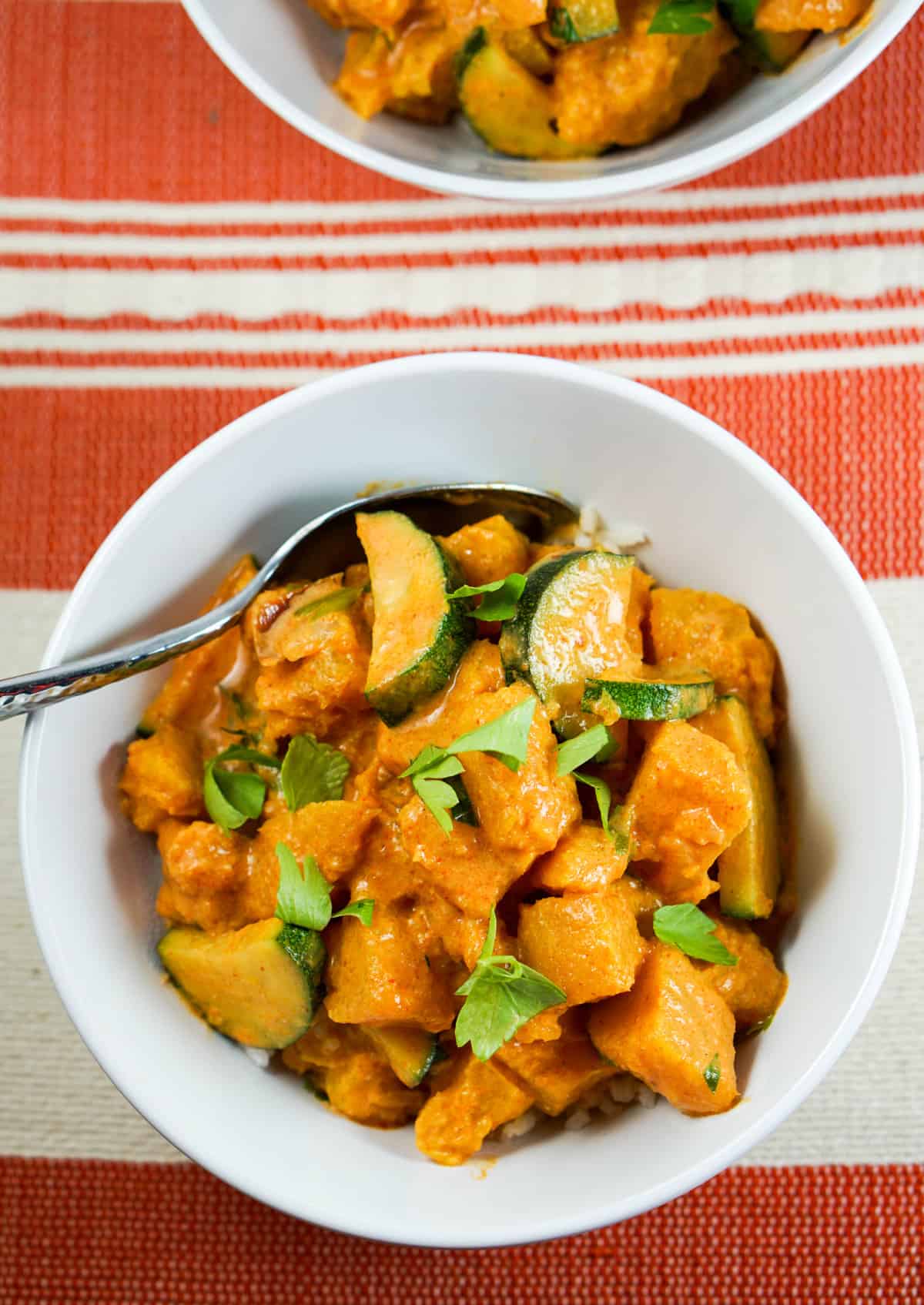 Pumpkin Coconut Red Curry Recipe - Healthy clean eating curry recipe using real whole food. Great served by itself or over rice or zoodles. 