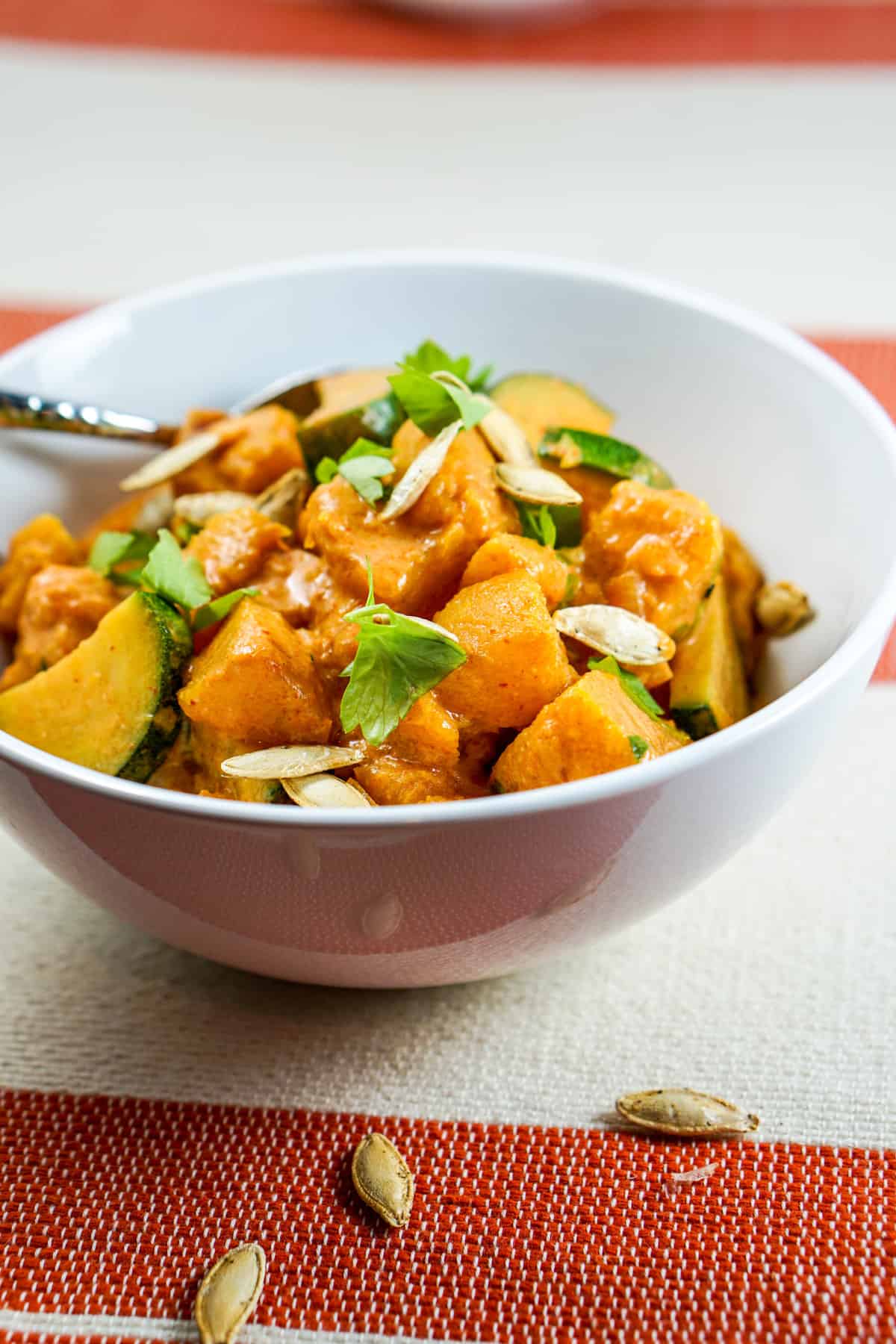 Pumpkin Coconut Red Curry Recipe - Healthy clean eating curry recipe using real whole food. Great served by itself or over rice or zoodles. 