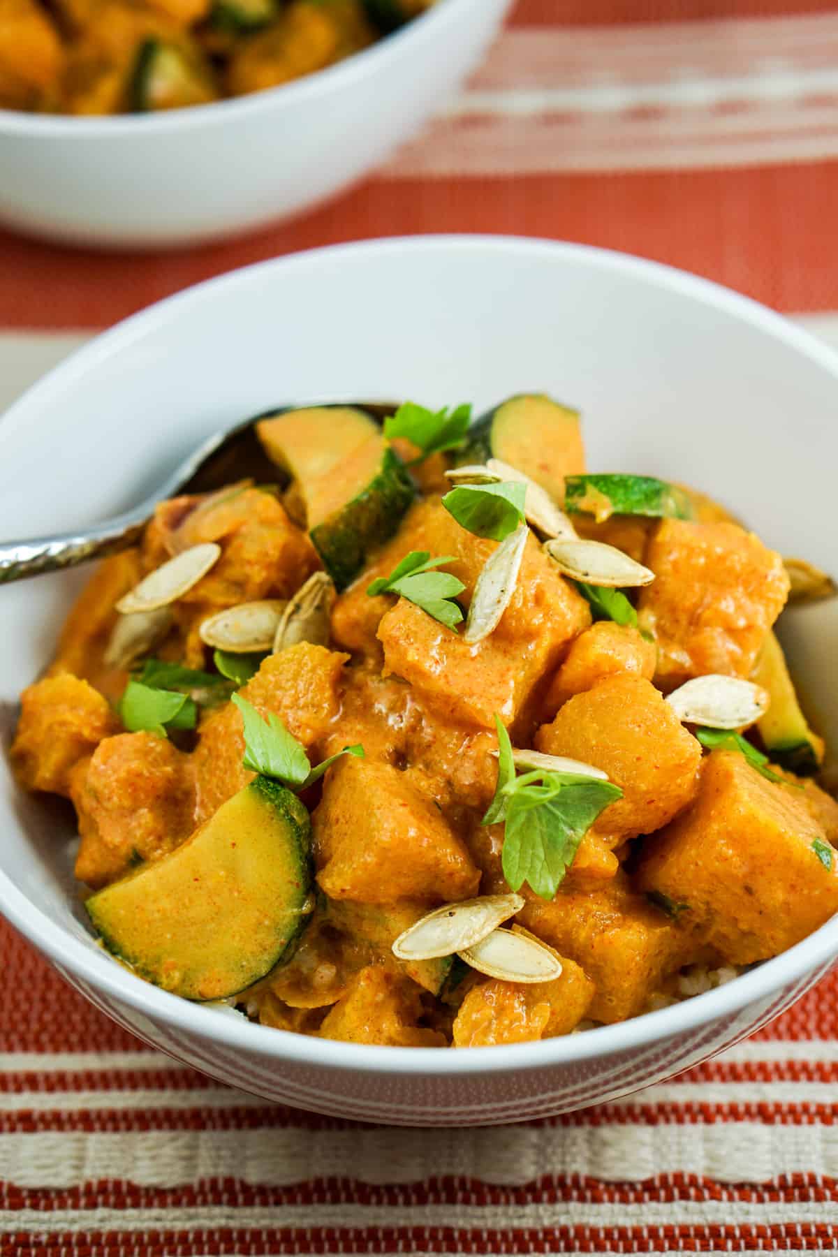 Pumpkin Coconut Red Curry Recipe - Healthy clean eating curry recipe using real whole food. Great served by itself or over rice or zoodles. 