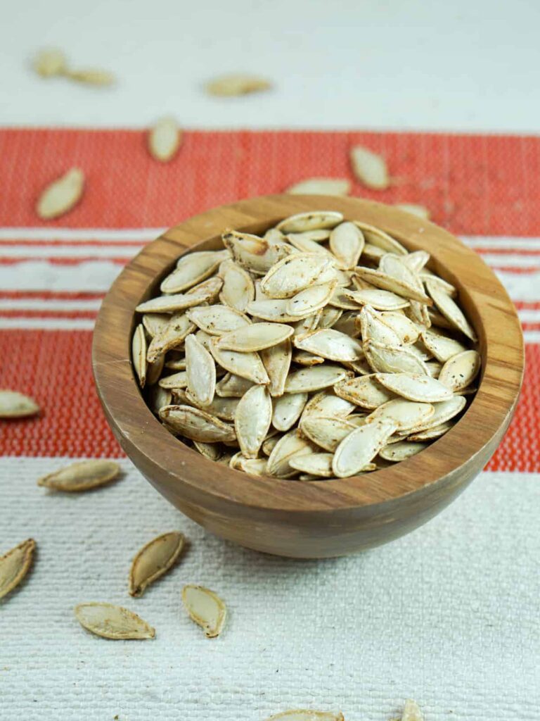 This toasted salted pumpkin seeds recipe is ridiculously easy. Wash & strain, season, dry and roast for deliciously crisp seeds. Then crunch away and enjoy!