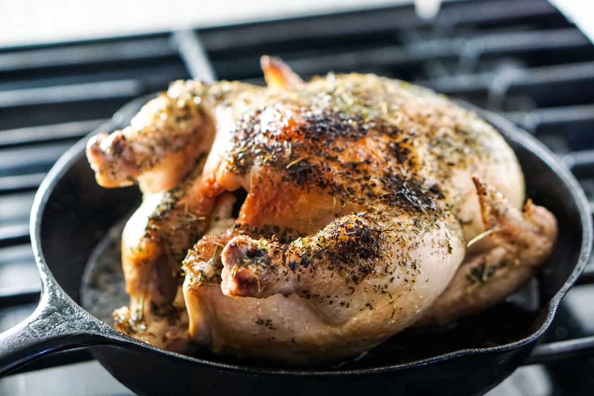 Simple Whole Roasted Herb Chicken Recipe - Just 5 minutes of active time and 1 hour baking for this clean eating head-to-toe recipe