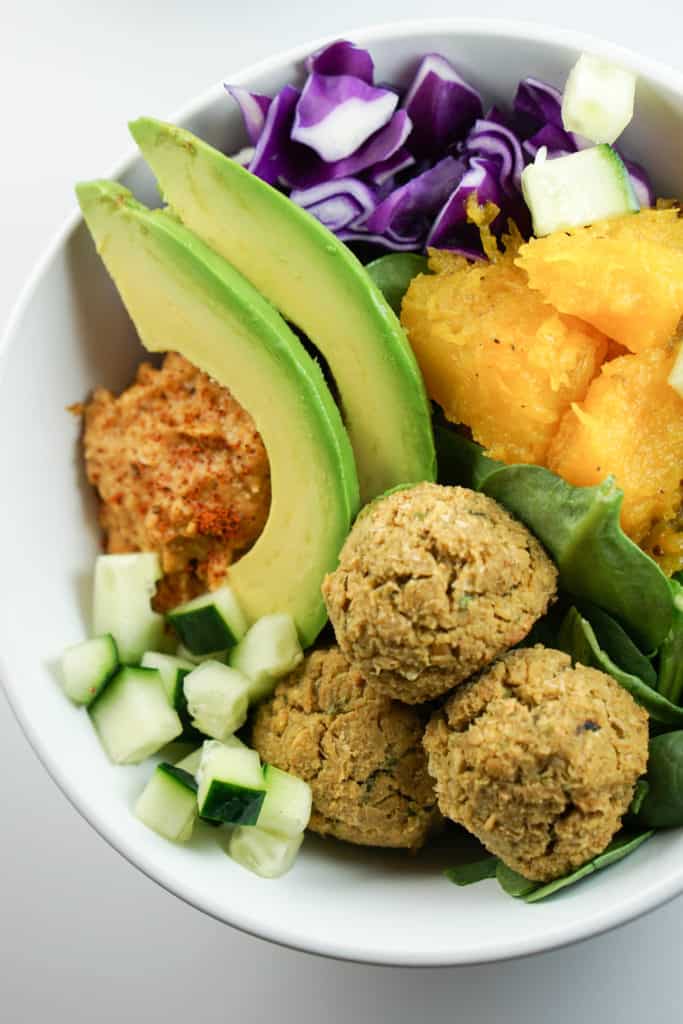 Quick, fresh and Easy falafel bowls with roasted squash, avocado and harissa hummus recipe. A perfect healthy dinner. Absolutely delish and satisfying. 