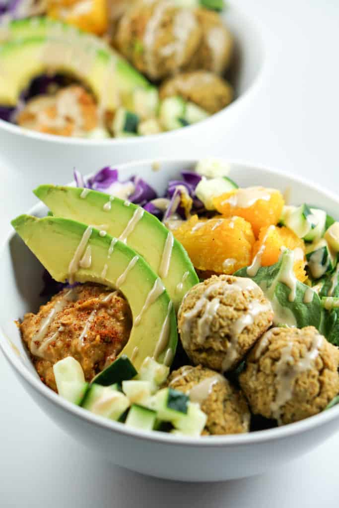 A savory alternative to salad, these quick and easy Falafel Bowls with roasted squash, avocado and harissa hummus recipe make a perfect healthy dinner.
