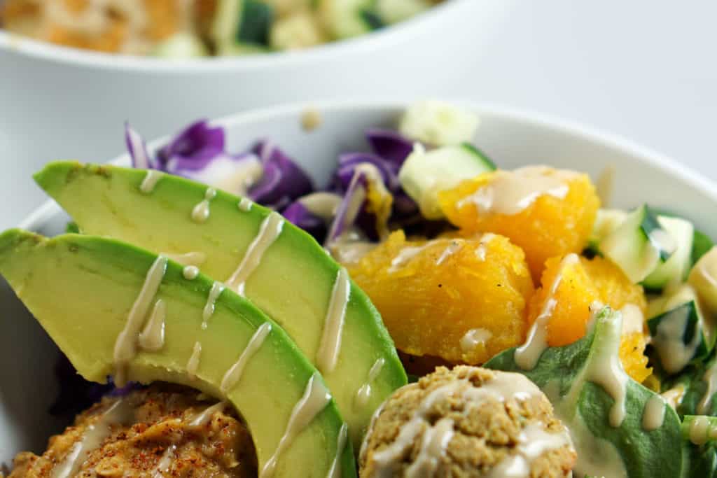 A savory alternative to salad, these quick and easy Falafel Bowls with roasted squash, avocado and harissa hummus recipe make a perfect healthy dinner.