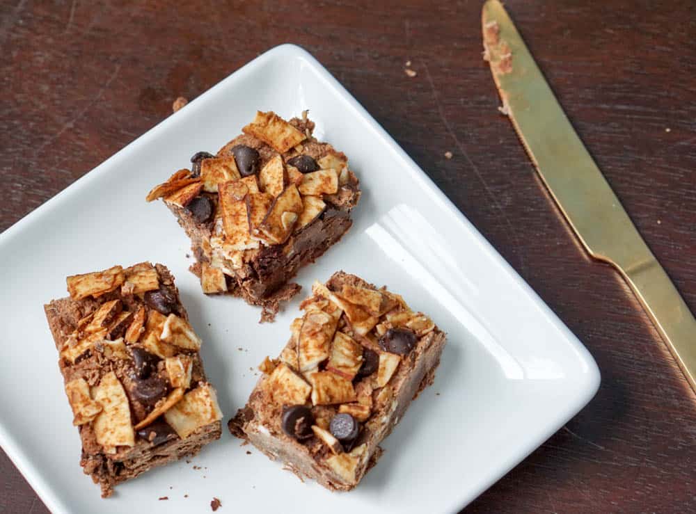 Chocolate Masala Fudge squares take cinnamon, cardamom fudge to the next level. Packed with ginger, dates, and coconut - this decadent treat is healthy!