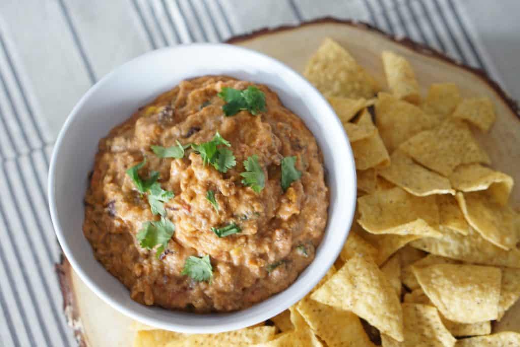 Healthy Creamy Chip Dip Recipe: A creamy savory chip dip that's sure to be a crowd pleaser. They'll never know that its healthy and has no cheese! Ground beef, hummus, salsa and spices.