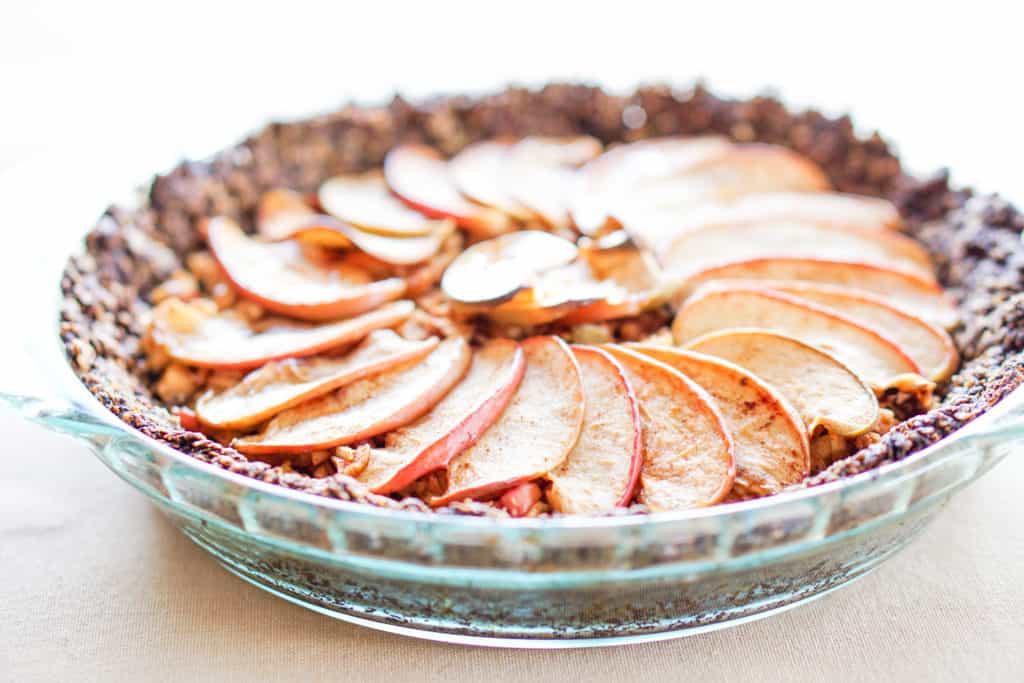 Apple Tart with Drop Cookie Crust Recipe: Warm spiced apples wrapped in a comforting chocolate drop cookie crust. Gluten, dairy, and refined sugar free.