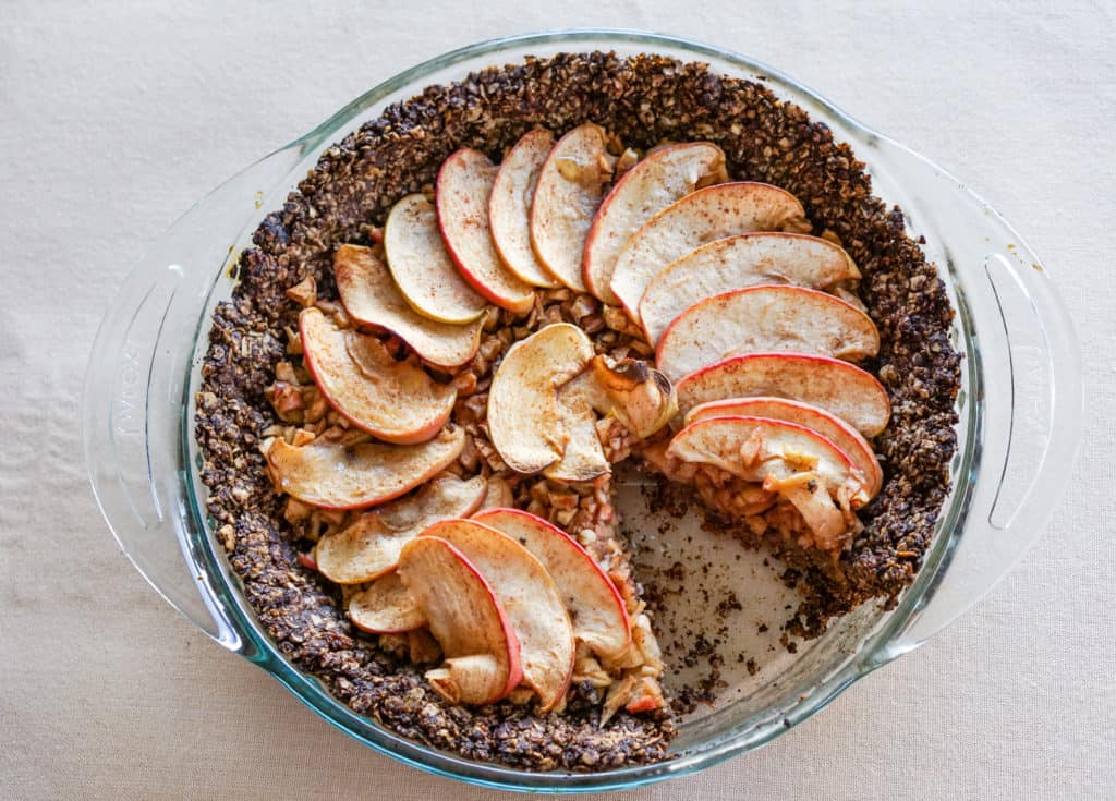 Apple Tart with Drop Cookie Crust Recipe: Warm spiced apples wrapped in a comforting chocolate drop cookie crust. Gluten, dairy, and refined sugar free.