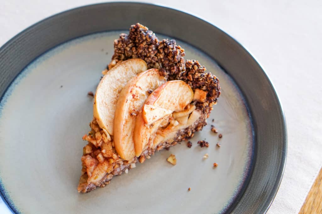 Apple Tart with Drop Cookie Crust Recipe: Warm spiced apples wrapped in a comforting chocolate drop cookie crust. Gluten, dairy, and refined sugar free.