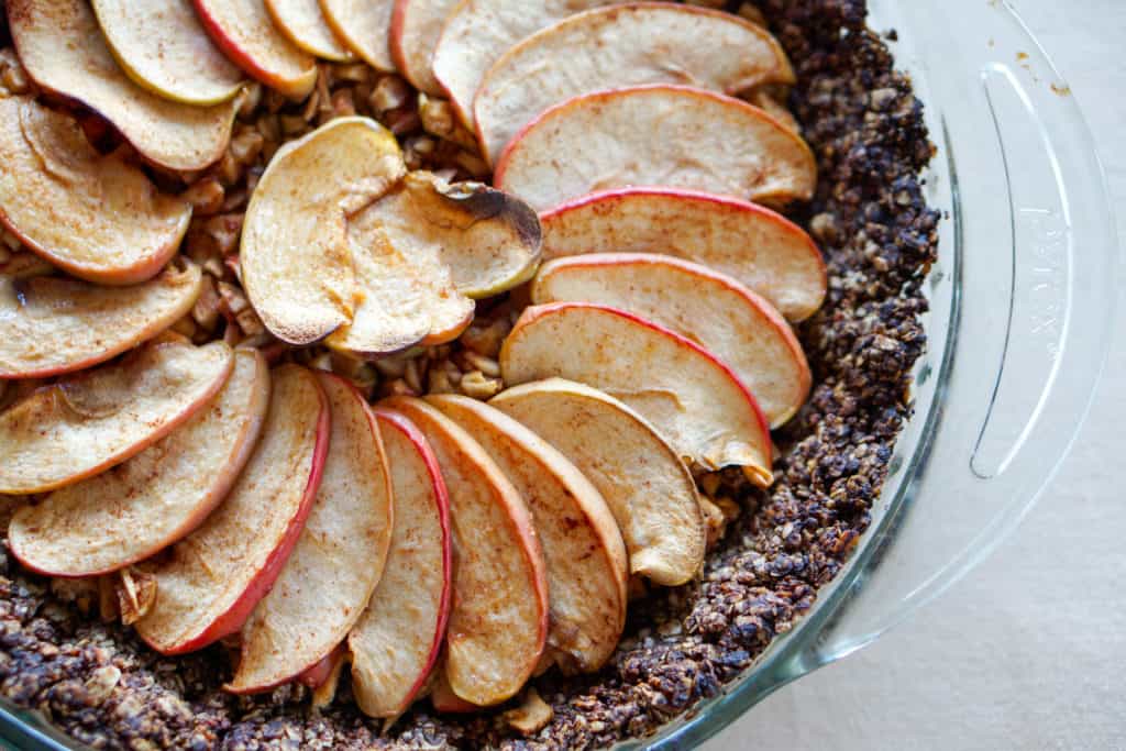 Apple Tart with Drop Cookie Crust Recipe: Warm spiced apples wrapped in a comforting chocolate drop cookie crust. Gluten, dairy, and refined sugar free.