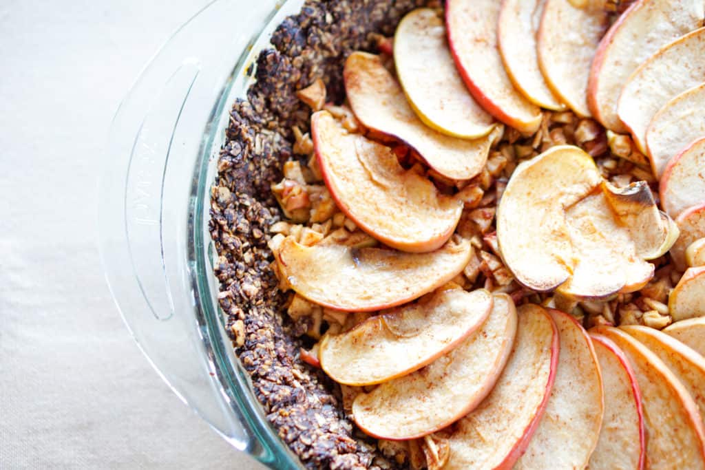 Apple Tart with Drop Cookie Crust Recipe: Warm spiced apples wrapped in a comforting chocolate drop cookie crust. Gluten, dairy, and refined sugar free.