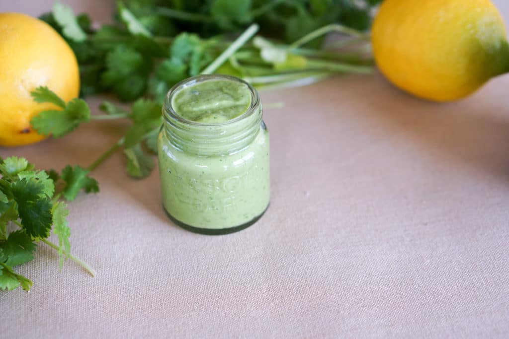 Simple 5 ingredient Creamy Avocado Cilantro Sauce Recipe makes a great Paleo or Whole 30 salad dressing or side sauce that's gluten free and dairy free.