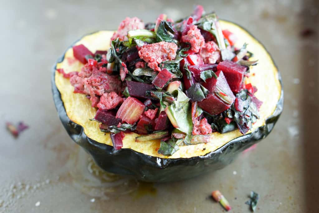 A healthy paleo and whole 30 friendly dinner idea: Beet, Dandelion and Grass-Fed Beef Stuffed Acorn Squash recipe full of protein,vegetables and greens