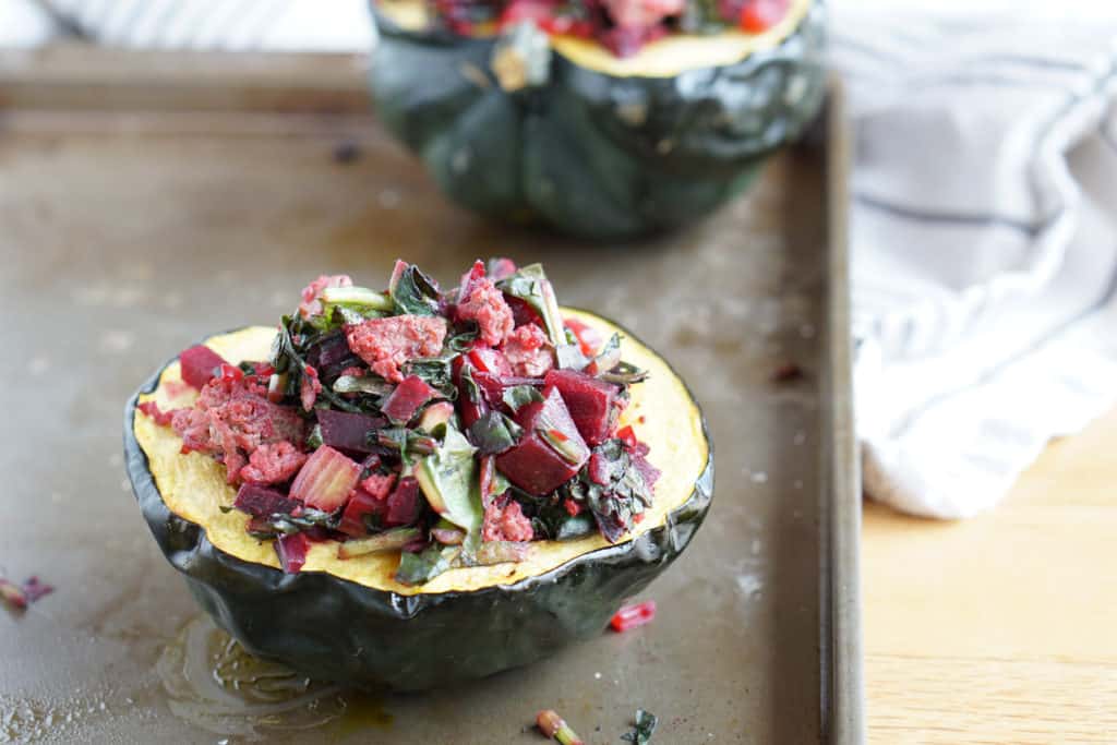 A healthy paleo and whole 30 friendly dinner idea: Beet, Dandelion and Grass-Fed Beef Stuffed Acorn Squash recipe full of protein,vegetables and greens