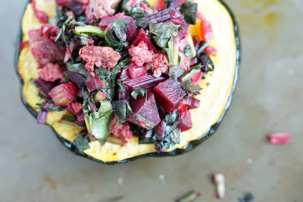 A healthy paleo and whole 30 friendly dinner idea: Beet, Dandelion and Grass-Fed Beef Stuffed Acorn Squash recipe full of protein,vegetables and greens