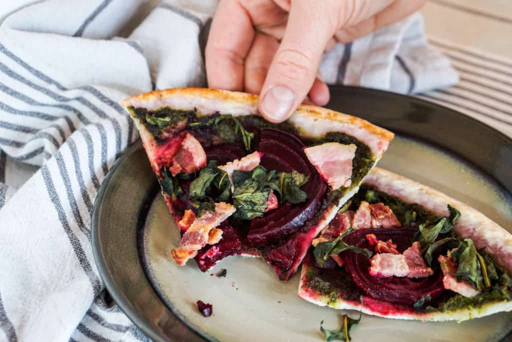 The healthiest pizza on earth. This gluten free, dairy free Beet and Dandelion Flatbread Recipe is chocked full of detoxing nutrients. Perfect spring meal.