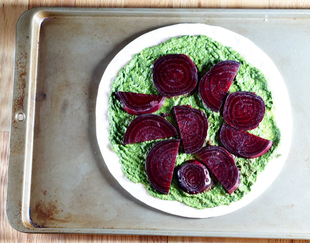 The healthiest pizza on earth. This gluten free, dairy free Beet and Dandelion Flatbread Recipe is chocked full of detoxing nutrients. Perfect spring meal.