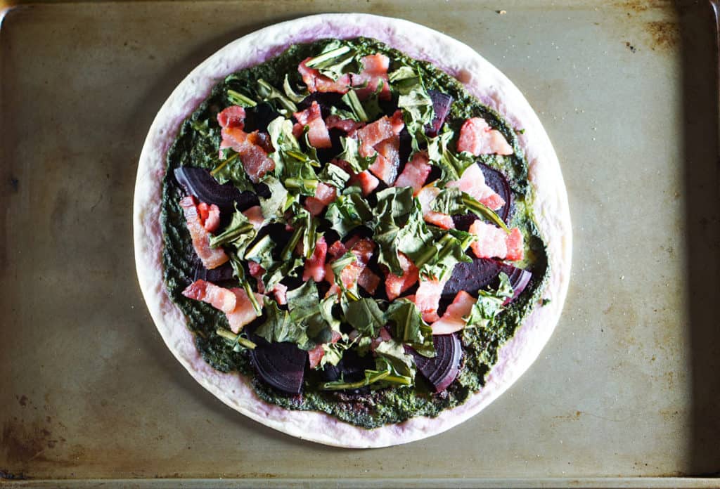 The healthiest pizza on earth. This gluten free, dairy free Beet and Dandelion Flatbread Recipe is chocked full of detoxing nutrients. Perfect spring meal.