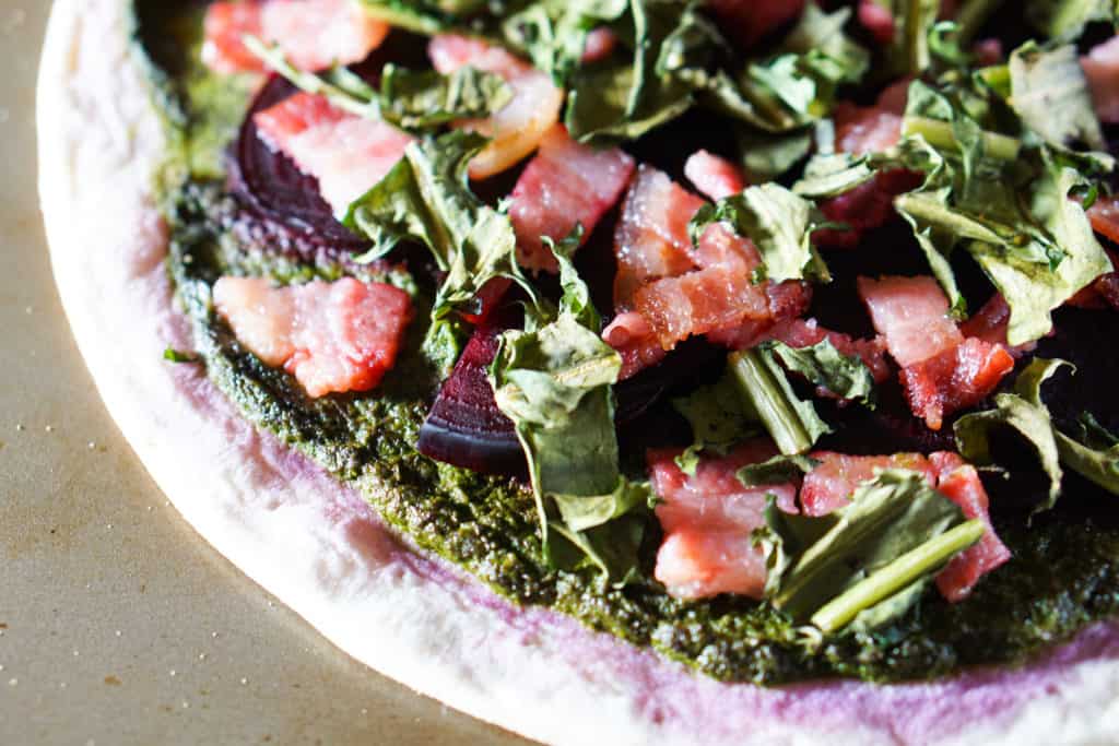 The healthiest pizza on earth. This gluten free, dairy free Beet and Dandelion Flatbread Recipe is chocked full of detoxing nutrients. Perfect spring meal.