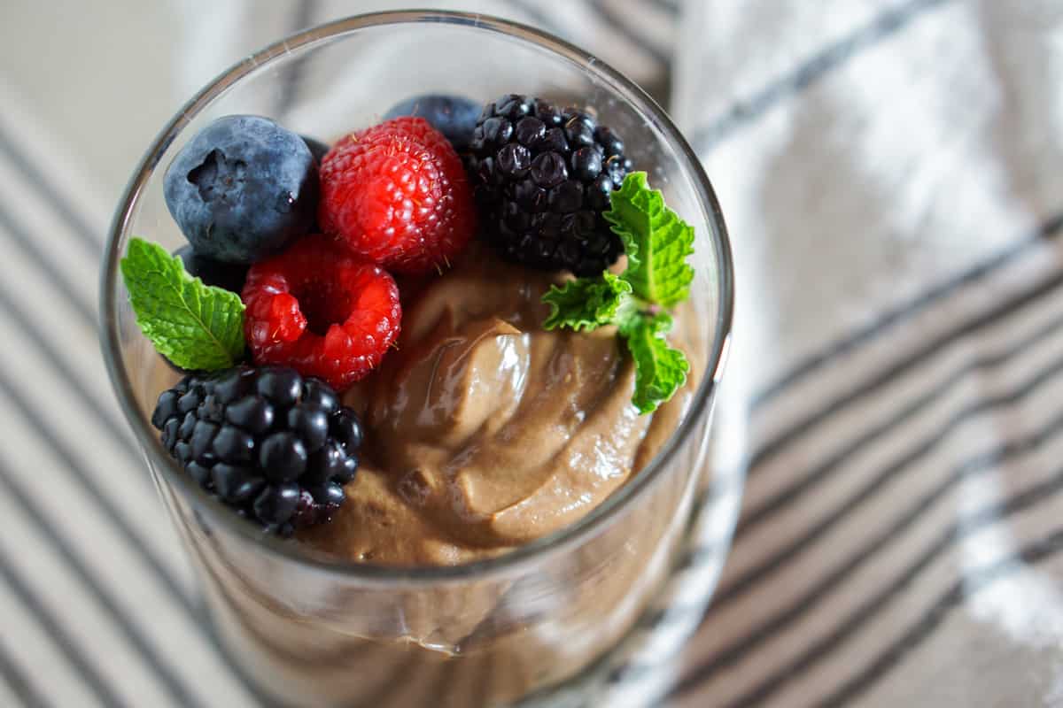 Chocolate Avocado Mouse with Mixed Berries - A simple 5 ingredient, plant-based and paleo dessert made of avocados, coconut, and berries. GF, DF, RSF