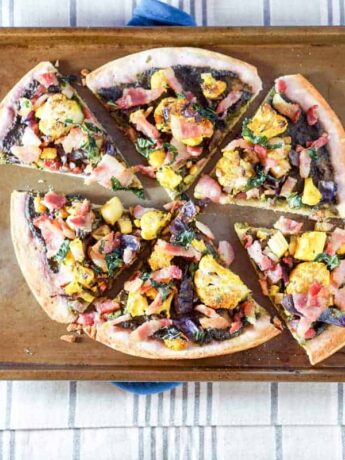 This Roasted Cauliflower and Kale Sauce Flatbread Recipe is a completely reinvented look at pizza: gluten free crust, nightshade free sauce, and dairy free.