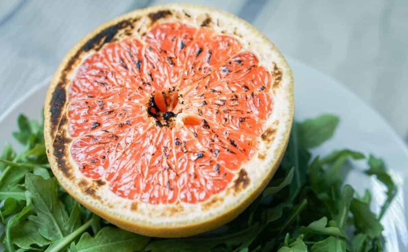 This brûléed grapefruit recipe showcases caramelized sugars without added refined sugars and cream. Add tossed arugula for a paleo, whole 30, GF, DF lunch.
