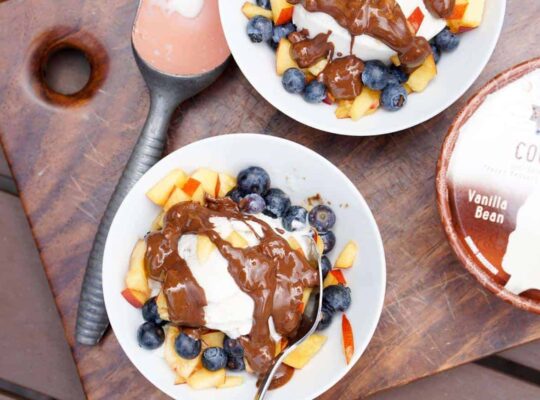 Fresh berries, creamy coconut ice cream, healthy magic shell make this great dairy free coconut berry sundae with homemade peanut butter chocolate drizzle