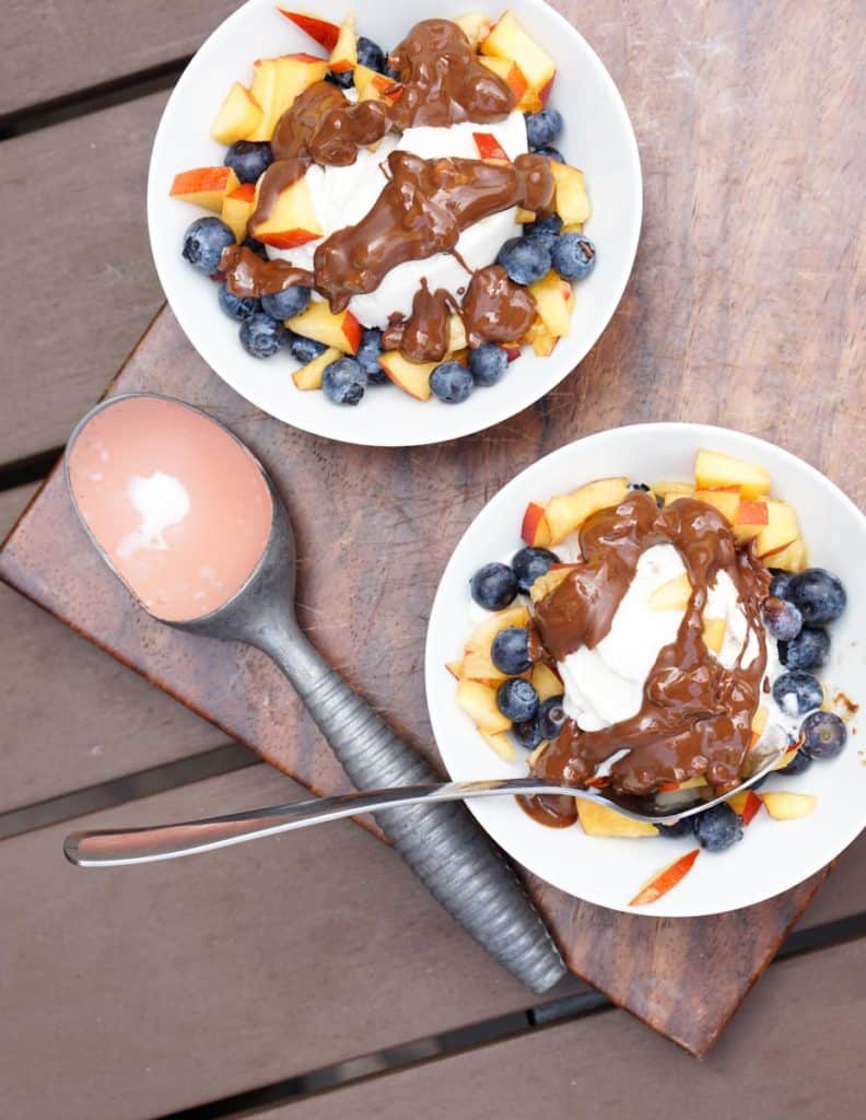 Fresh berries, creamy coconut ice cream, healthy magic shell make this great dairy free coconut berry sundae with homemade peanut butter chocolate drizzle