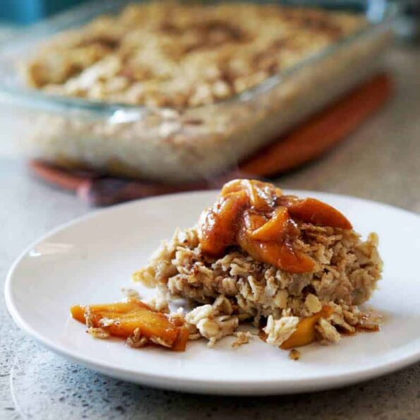 This easy egg alternative will save time in the mornings. Gluten free, dairy free, refined sugar free, paleo and vegan healthy baked oatmeal made with peaches and rhubarb recipe with just enough cinnamon and nutmeg.