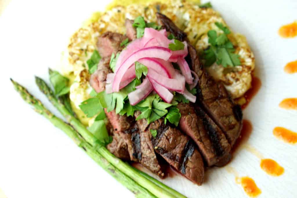 The Deconstructed Steak Taco on Curried Cauliflower Steak recipe merges the flavors of street tacos with Asian cuisine and the traditional steak house: Latin fusion that's healthy, gluten free, grain free and dairy free.