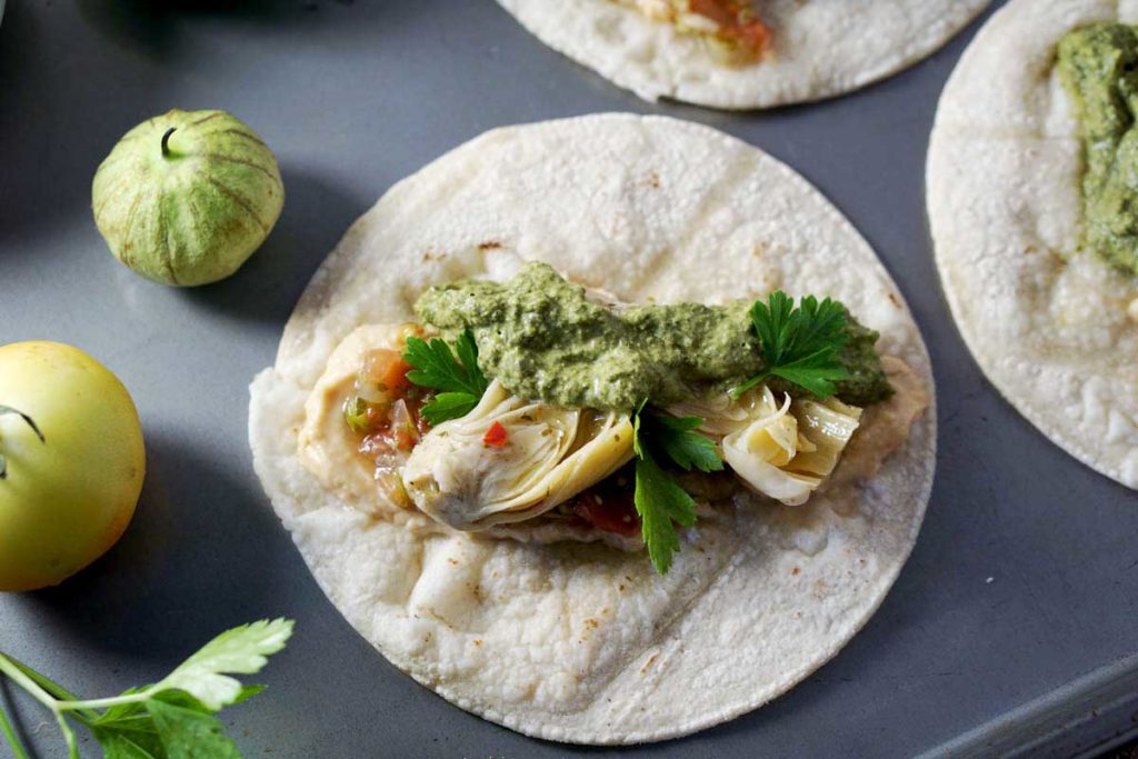 quick and easy tacos, made with hummus, salsa, and marinated artichoke hearts. Quick and easy meatless monday meal