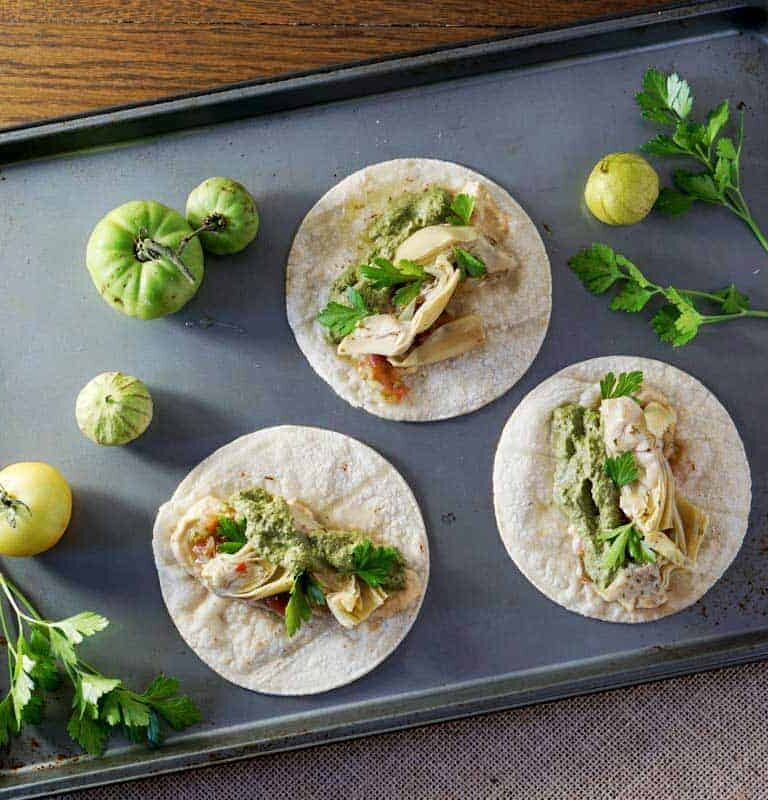 quick and easy tacos, made with hummus, salsa, and marinated artichoke hearts. Quick and easy meatless monday meal
