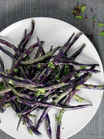 Blistered Purple Hyacinth green beans sauteed with white truffle paste create a purple and green tie-dyed plate that's the perfect savory accompaniment for any dinner.