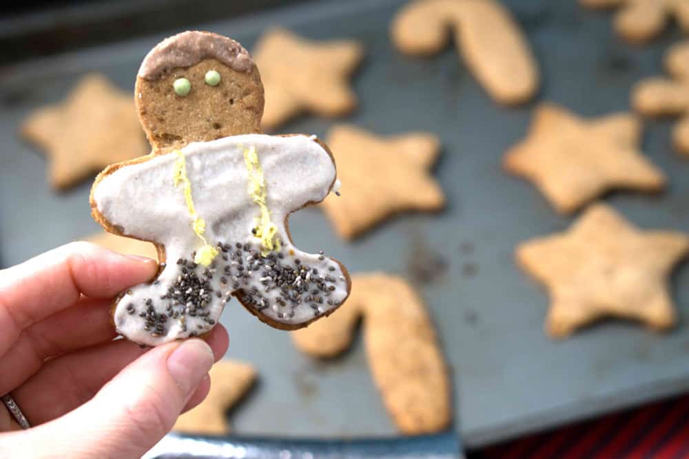 a healthy gingerbread man - made of gluten free cut out cookies and cashew date frosting!