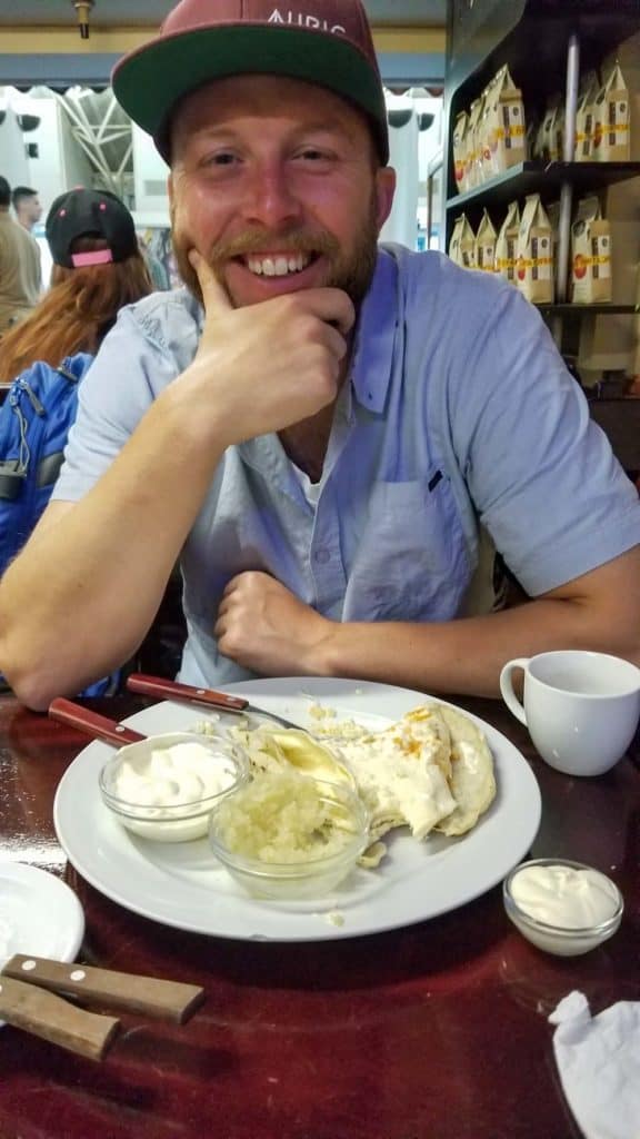 John trying the quesillo a the Managua airport - a Nica classic