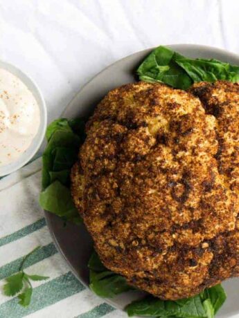 Roasted Harissa Cauliflower with Whipped Tahini makes a great side dish, dinner, and topping for salad bowls.