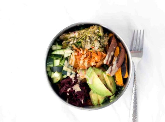 Loaded Kale Salad Bowl Recipe with Sweet potatoes, cucumbers, beets, Kimchi, tahini brocolini, avocado on tahini massaged Kale