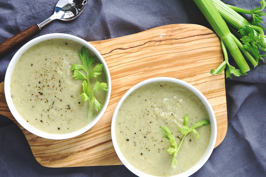 Paleo cream of celery soup recipe without the cream? This refreshing gluten free, dairy free soup uses cauliflower and healthy oils instead.