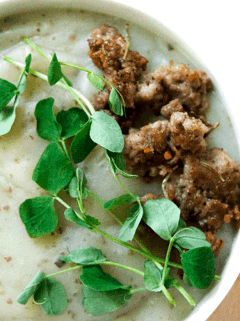 Creamy potato soup with Italian sausage and pea sprouts is savory, creamy, full of gut healing nutrients, perfect for when your craving carbs yet want to be healthy.