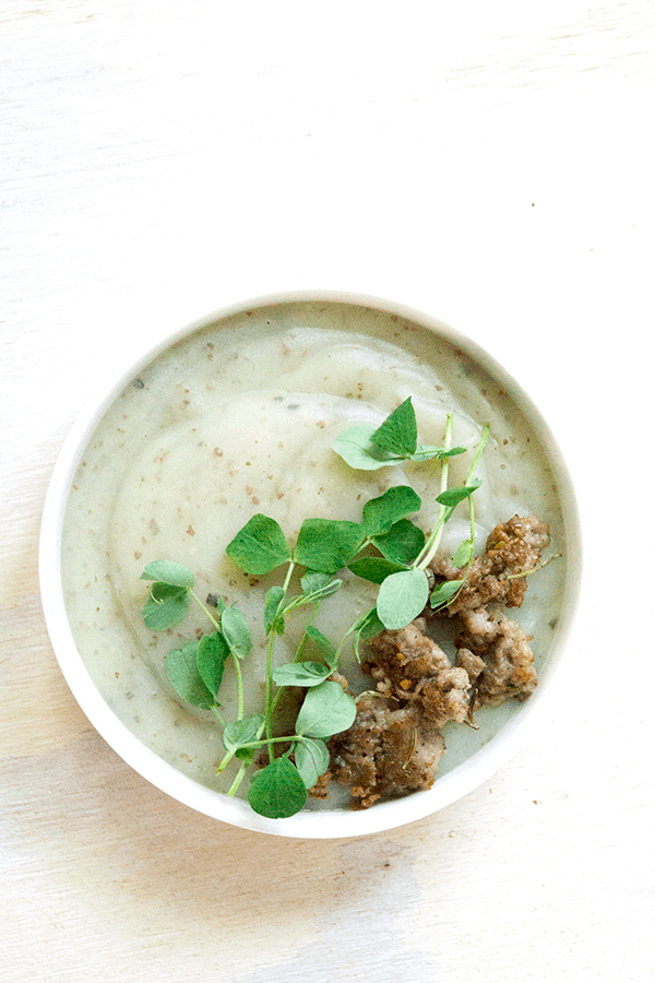 Creamy potato soup with Italian sausage and pea sprouts is savory, creamy, full of gut healing nutrients, perfect for when your craving carbs yet want to be healthy.