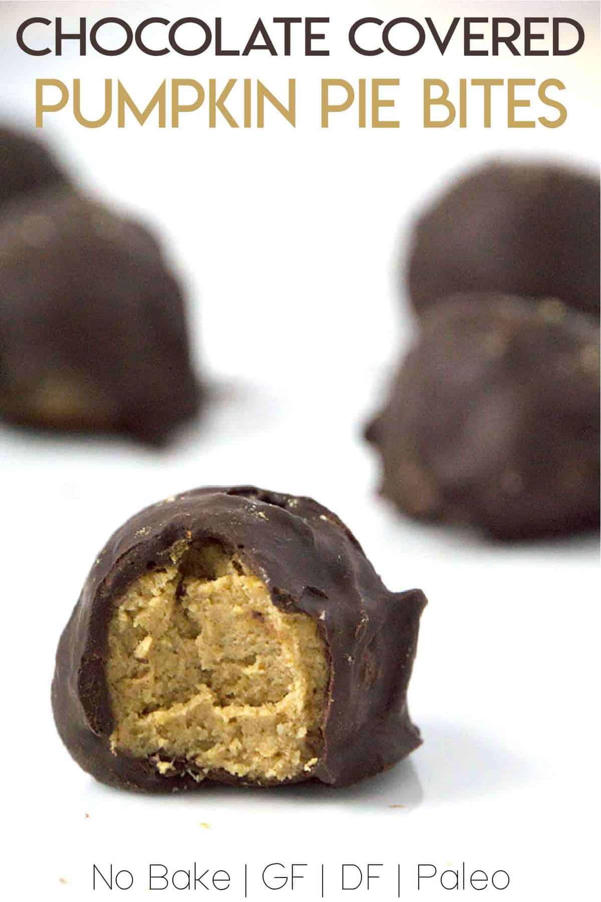 Paleo chocolate covered pumpkin pie bites are rich and creamy, densely packed with health-supporting spices and real pumpkin, stuffed with coconut butter and doused in chocolate.