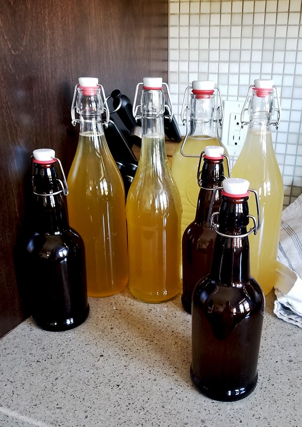 Home brewed bottles of Home brewed Jun, a honey and green tea version of kombucha