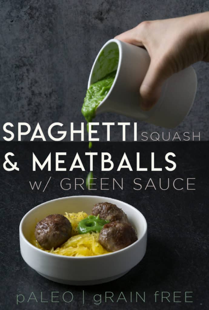 Green sauce dripping onto meatballs on spaghetti squash in white bowl on dark marble and poured concrete surface