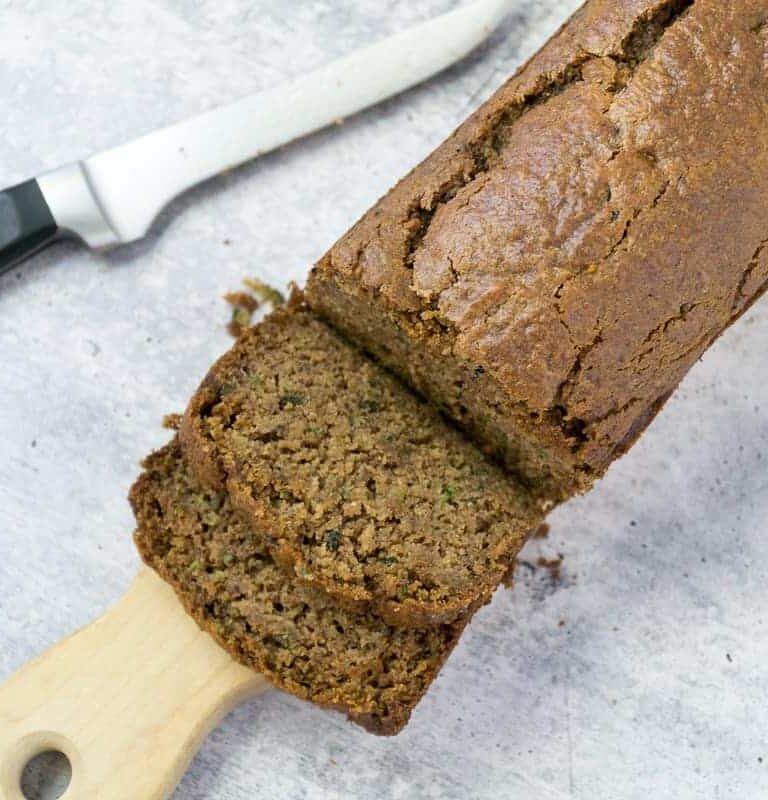 sliced gluten free zucchini bread with knife