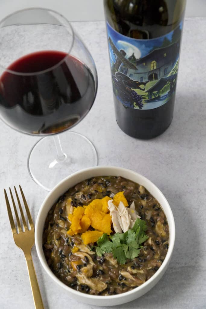 pumpkin black rice risotto with flora spring red wine and golden fork