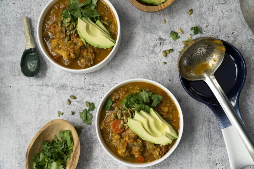 Ladled Pumpkin chili with toppings