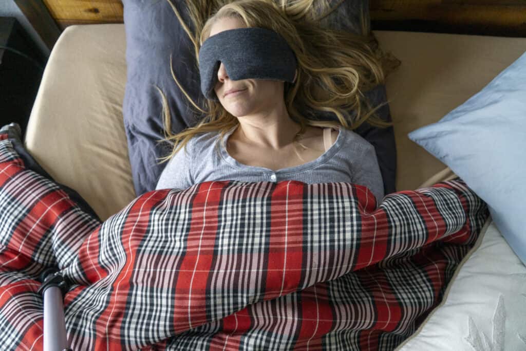 sleep masks in bed with flannel comforter