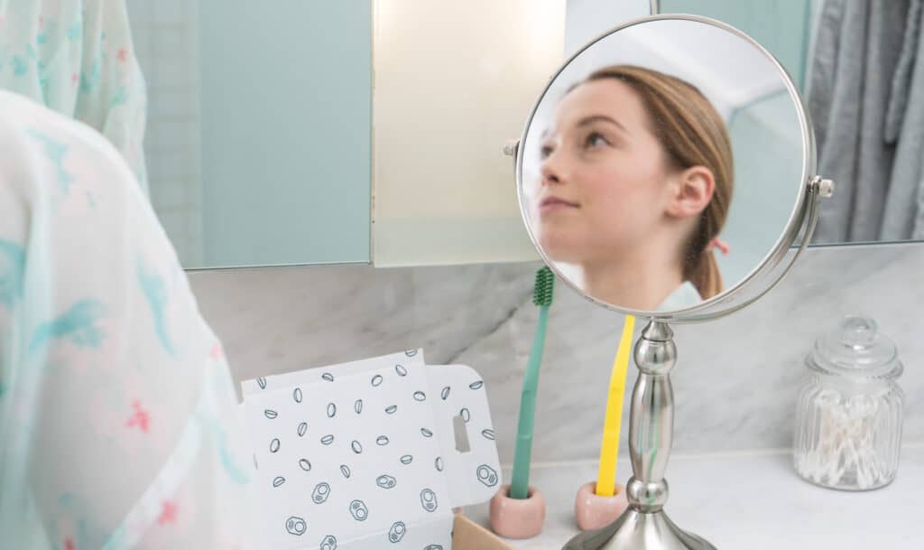 Girl in Bathroom getting ready for bed